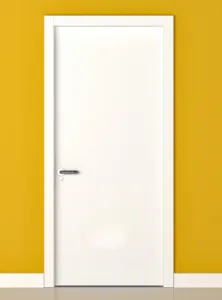Painted white interior door with lever handle and white casing against a mustard yellow wall