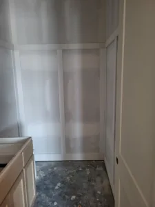 Door frame with jamb and casing installed in a closet opening, unfinished, ready for paint
