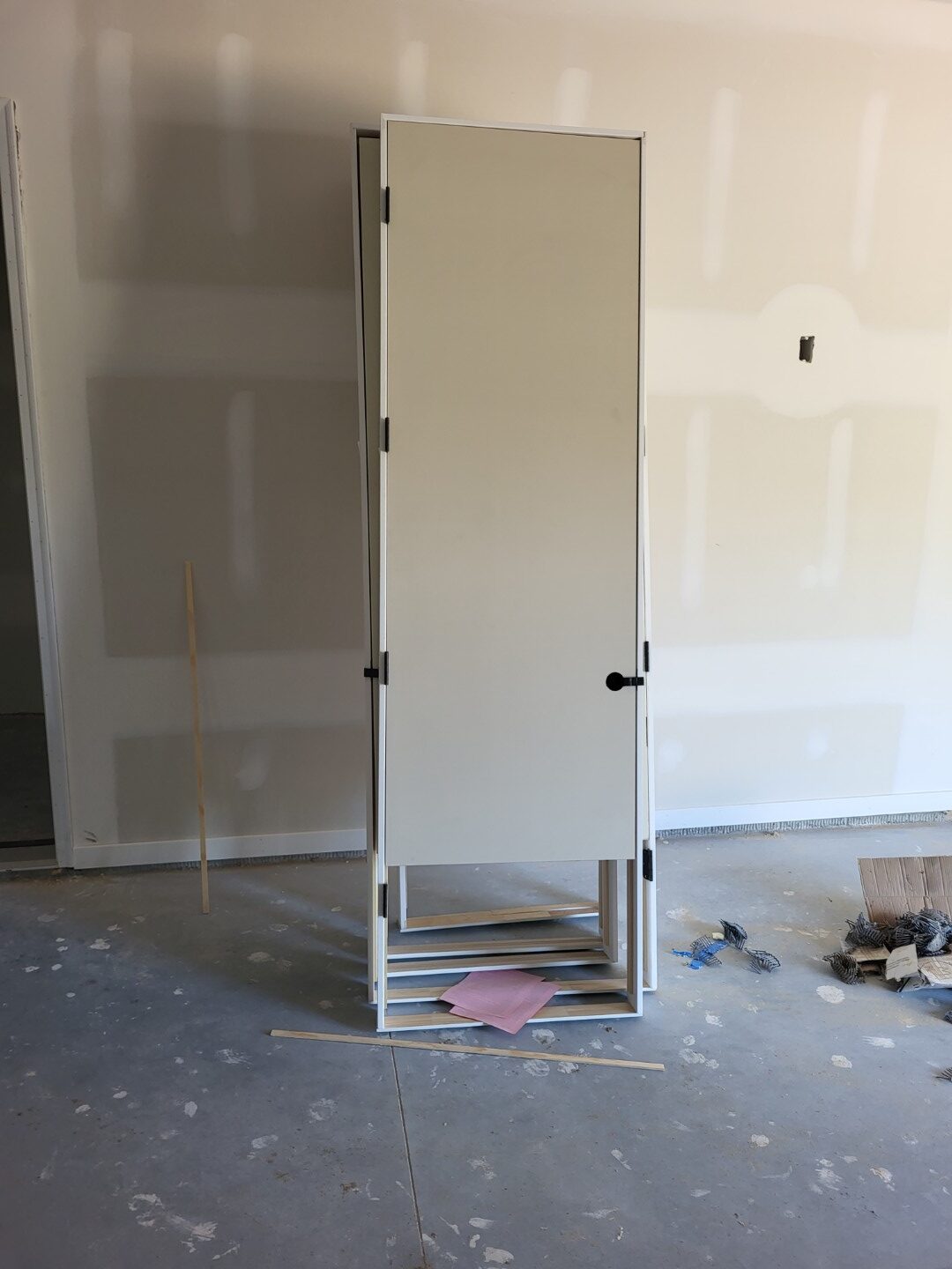 8 foot solid core pre-hung door staged in the opening before installation