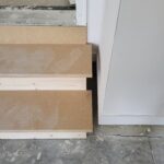 Staged closet shelving materials stacked and organized before installation.