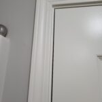 Painted bi-fold/bypass door frame with white casing and jamb, ready for door slabs to be hung.