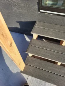 Composite deck steps under construction on wood support stringers