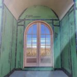 Arched-top exterior door with multi-pane glass and wood frame installed in opening with house wrap and temporary protection.