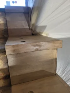 Unfinished wood block with rounded cap detail and drilled dowel hole, ready for paint