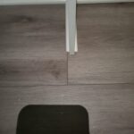 Painted door jamb installed on LVP flooring with clean seams and proper alignment.