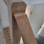 Close-up of a finished wood nosing detail on a staircase, showcasing craftsmanship and joinery.