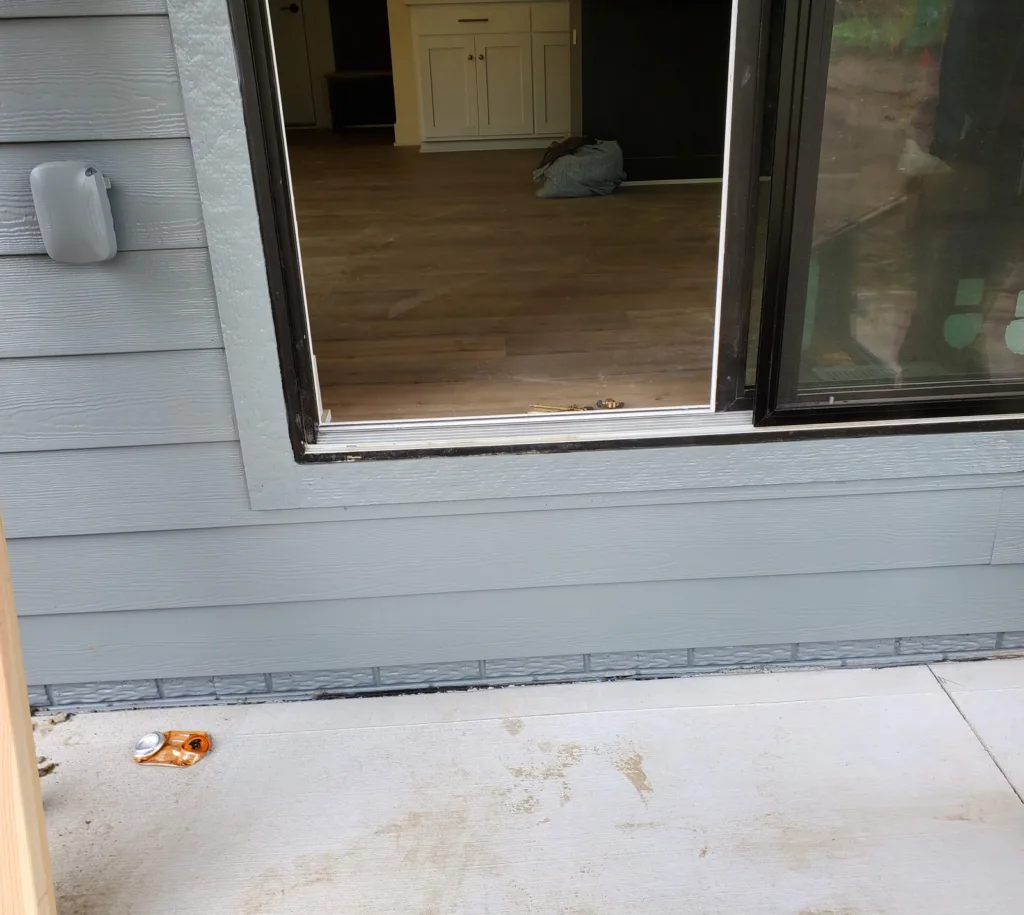 Back patio slab below a sliding door before any steps are built
