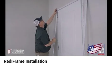 Installer fits upright metal casing onto the corner clip beneath the RediFrame head casing.