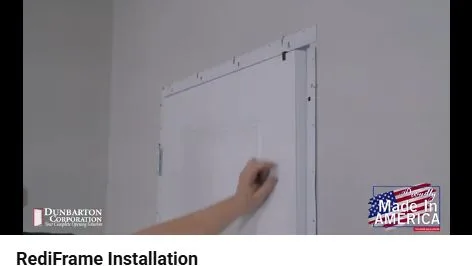 Thin temporary spacer holds the gap between the top of the door slab and the RediFrame head.